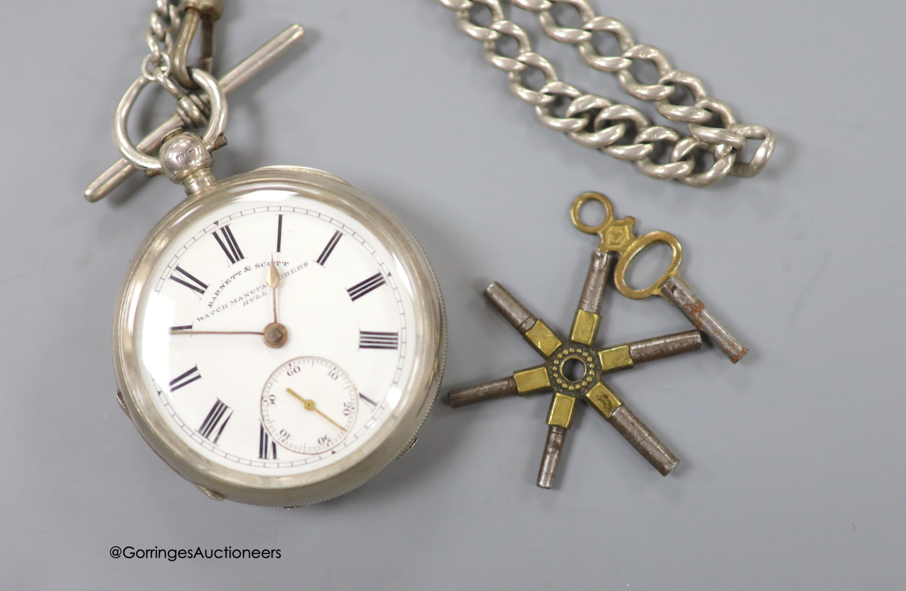 A late Victorian silver open face keywind pocket watch by Barnett & Scott, on a silver albert with key and multi key 'wheel'.